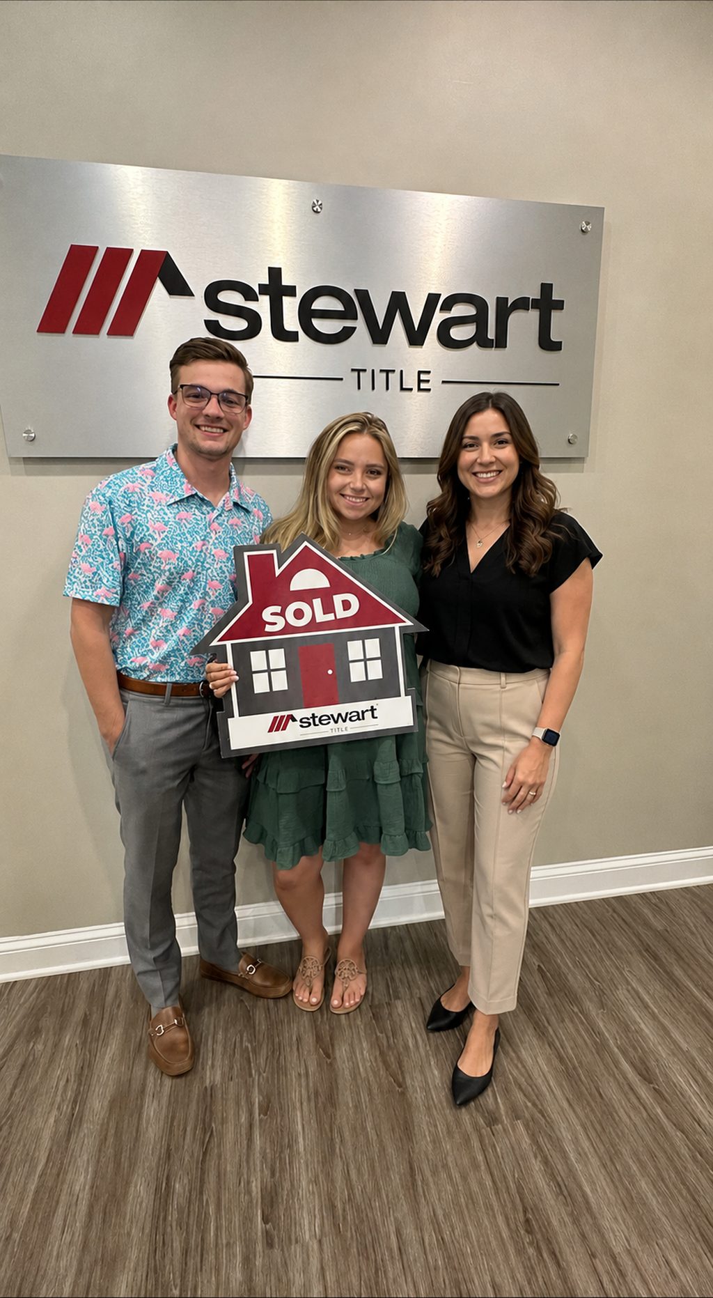 Brody Preston with clients at a real estate closing